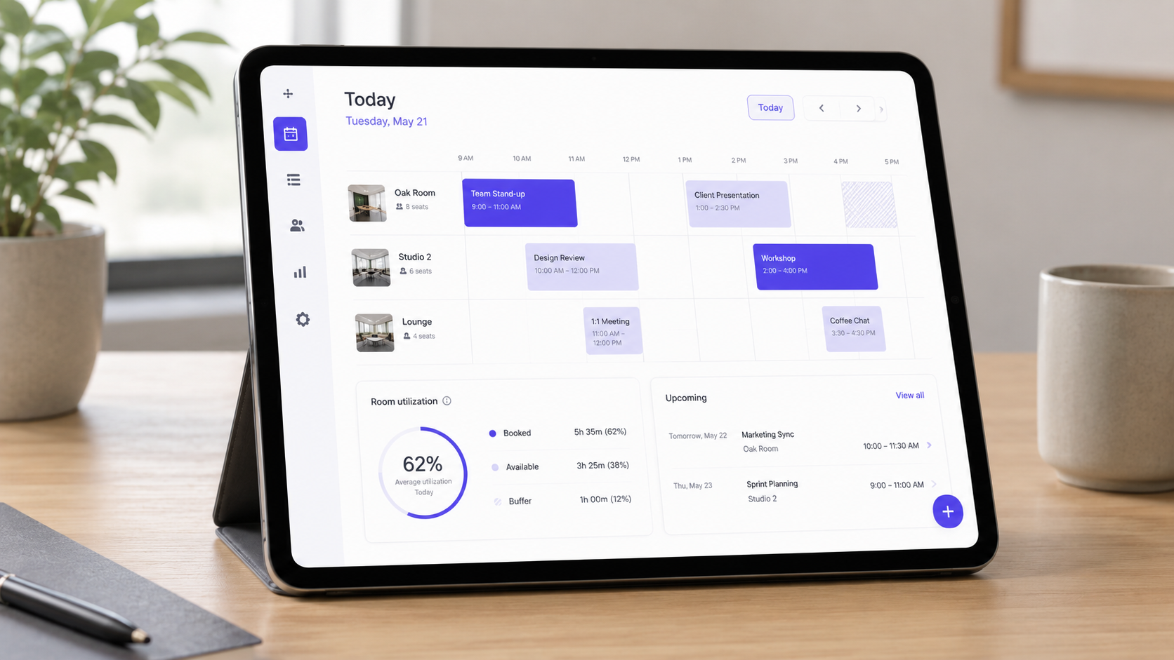 Tablet dashboard showing a day schedule for three meeting rooms with utilization stats